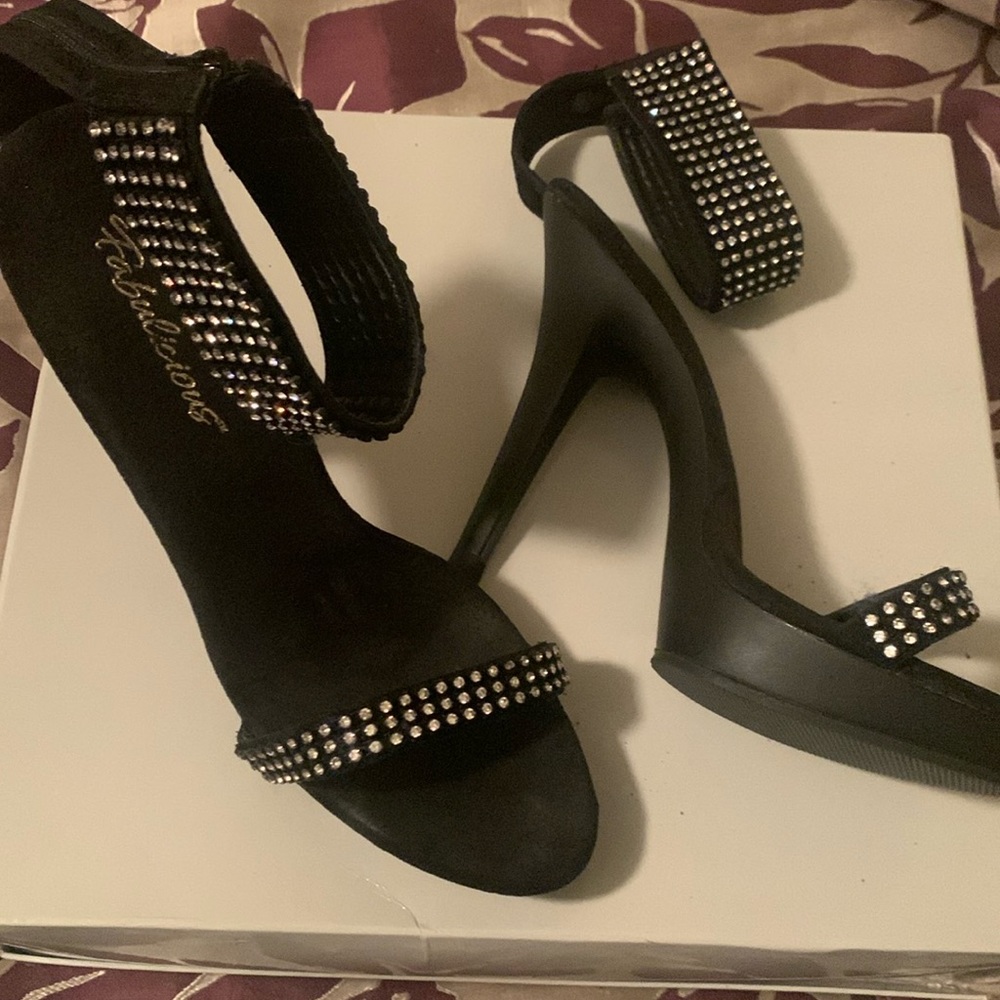 Sexy Rhinestone 4 1/2 inch high heel with 1 and 1/2 platform.  thick ankle strap